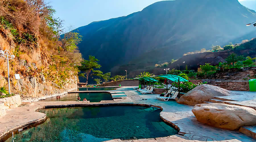 Cocalmayo thermal baths surrounded by green mountains in Santa Teresa