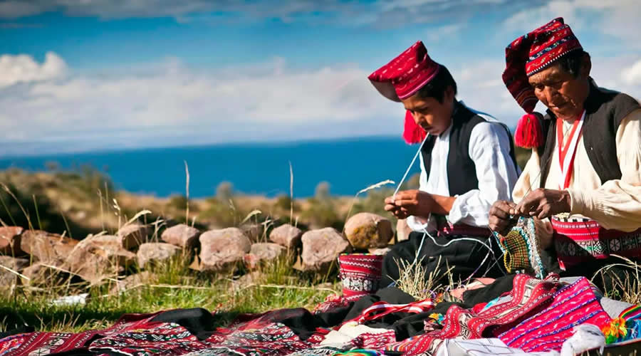 Taquile Island men knitting traditional textiles on Lake Titicaca